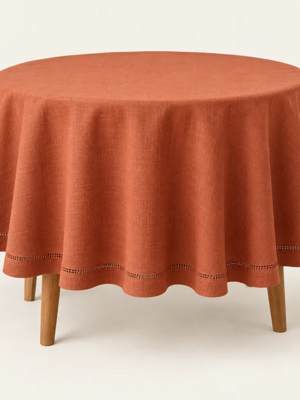 Terracotta Hemstitch Tablecloth on a warm ivory background — AI-generated design illustration