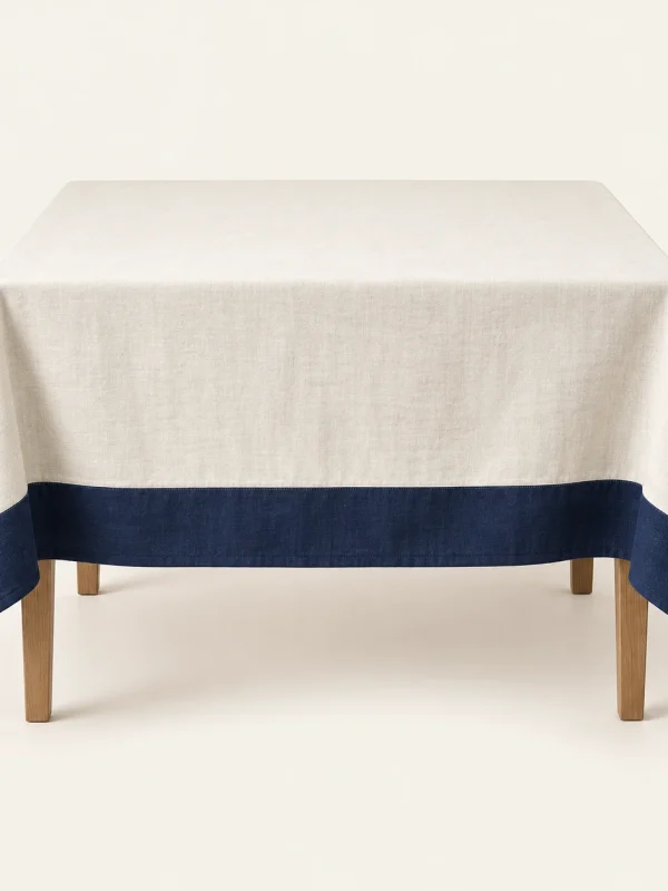 Navy Border Tablecloth on a warm ivory background — AI-generated design illustration
