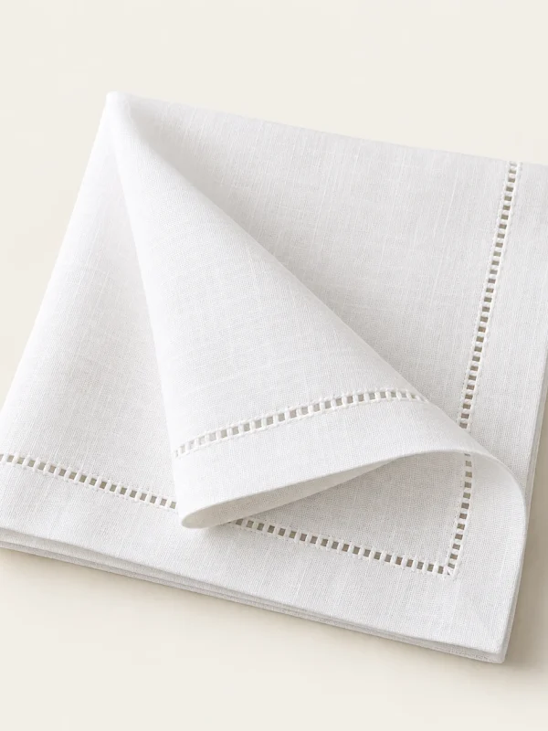 White Hemstitch Napkin on a warm ivory background — AI-generated design illustration