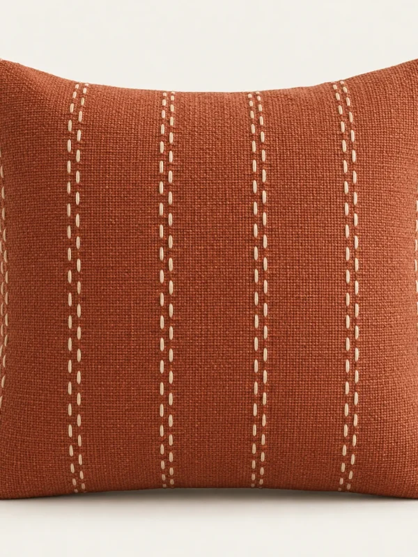 Terracotta Stitch Cushion Cover — original high-resolution design illustration Terracotta Stitch Cushion Cover on a warm ivory background — AI-generated design illustration