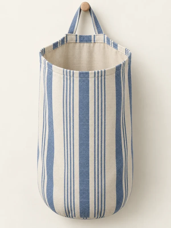 Blue Stripe Hanging Bag on a warm ivory background — AI-generated design illustration
