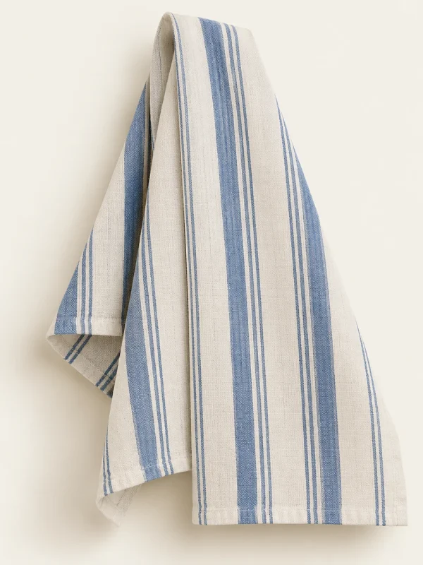 Blue Stripe Tea Towel on a warm ivory background — AI-generated design illustration