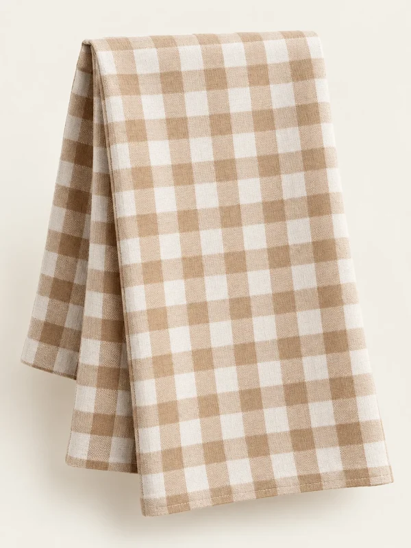 Gingham Kitchen Towel on a warm ivory background — AI-generated design illustration