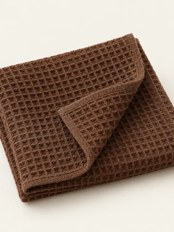 Cocoa Waffle Dishcloth on a warm ivory background — AI-generated design illustration