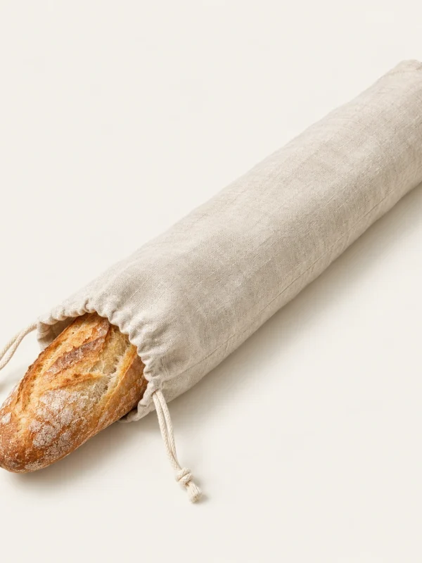 Natural Baguette Bag on a warm ivory background — AI-generated design illustration
