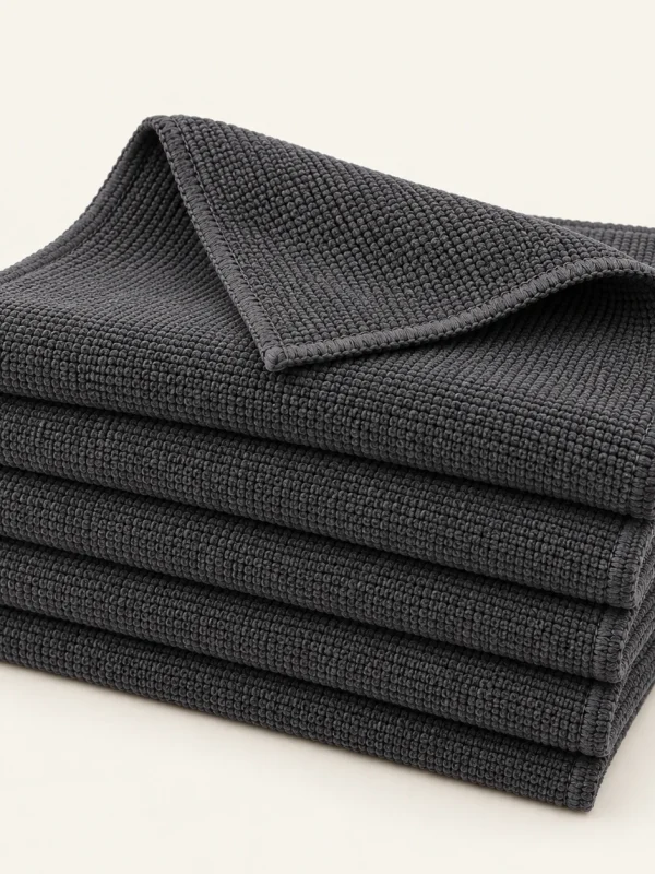 Charcoal Cleaning Cloth Set on a warm ivory background — AI-generated design illustration
