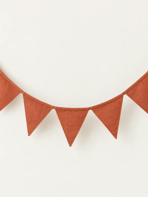Terracotta Fabric Bunting on a warm ivory background — AI-generated design illustration