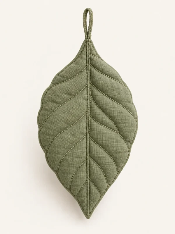 Quilted Leaf Ornament on a warm ivory background — AI-generated design illustration