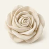 Ivory Fabric Rosette on a warm ivory background — AI-generated design illustration