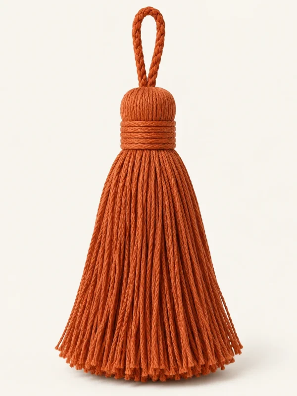 Rust Cotton Tassel on a warm ivory background — AI-generated design illustration